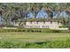 Beautifully landscaped entrance to the Toscana Isles community with stone signage at 624 Maraviya Blvd, Nokomis, FL 34275