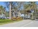 Stone gate at the entrance to the Toscana Isles community, surrounded by palm trees at 624 Maraviya Blvd, Nokomis, FL 34275