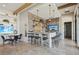 Community game room with a bar area featuring a brick accent wall and TV at 624 Maraviya Blvd, Nokomis, FL 34275