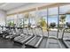 Bright gym overlooking the water featuring rows of treadmills with stunning water views at 624 Maraviya Blvd, Nokomis, FL 34275