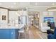 Open-concept kitchen boasts an island with seating, stainless steel appliances, and seamless flow into the living area at 624 Maraviya Blvd, Nokomis, FL 34275