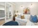 Cozy living room with sofa, stylish decor, and French doors, creating a comfortable and inviting space for relaxation at 624 Maraviya Blvd, Nokomis, FL 34275