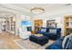 Bright living room with contemporary furnishings, light wood floors, and recessed lighting for a modern appeal at 624 Maraviya Blvd, Nokomis, FL 34275