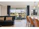 Open living space with a view of a beautiful backyard, flowing into a kitchen with barstool seating at 624 Maraviya Blvd, Nokomis, FL 34275