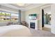 Inviting main bedroom featuring a window view, a fireplace, and plenty of natural light at 624 Maraviya Blvd, Nokomis, FL 34275