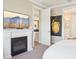 Relaxing main bedroom with a white fireplace, view to living room, and comfortable layout at 624 Maraviya Blvd, Nokomis, FL 34275