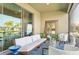 Relaxing screened patio offering comfortable seating, stylish decor, and sliding glass doors to the interior at 624 Maraviya Blvd, Nokomis, FL 34275