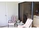 Comfortable balcony seating with striped chairs, small table, and a view of the indoors at 6287 Bahia Del Mar Cir # 101, St Petersburg, FL 33715