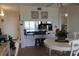 Open dining area with counter seating flows into the kitchen, perfect for casual meals at 6287 Bahia Del Mar Cir # 101, St Petersburg, FL 33715