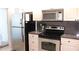 Updated kitchen featuring stainless steel appliances, granite counters, and neutral cabinetry at 6287 Bahia Del Mar Cir # 101, St Petersburg, FL 33715