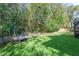 Serene backyard with lush lawn and swing at 70 Deerpath Dr, Oldsmar, FL 34677