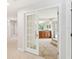 Bathroom featuring double vanity sinks, tiled floor, and a glass-enclosed shower at 70 Deerpath Dr, Oldsmar, FL 34677