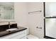 Bathroom featuring a modern vanity, framed mirror, and glass-enclosed shower at 70 Deerpath Dr, Oldsmar, FL 34677