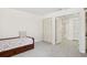 Bedroom with gray carpet, large closet, and single bed at 70 Deerpath Dr, Oldsmar, FL 34677