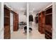 Walk-in closet with custom wood shelving and drawers for ample storage at 70 Deerpath Dr, Oldsmar, FL 34677