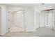 Hallway featuring closet storage, tile flooring, and white walls at 70 Deerpath Dr, Oldsmar, FL 34677