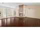 Open living room with a fireplace, dark wood floors, and bright entrance at 70 Deerpath Dr, Oldsmar, FL 34677