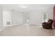Bright living room featuring tile flooring, a recliner, and natural light through two windows at 70 Deerpath Dr, Oldsmar, FL 34677