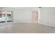 Bright living room with tile floors, a pool view, and neutral walls ready for personalization at 70 Deerpath Dr, Oldsmar, FL 34677