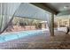Screened-in pool with covered patio and outdoor kitchen, ideal for entertaining at 70 Deerpath Dr, Oldsmar, FL 34677