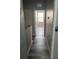 Hallway featuring wood-look tile flooring that leads to a naturally lit room at 724 4Th S Ave # 8, St Petersburg, FL 33701