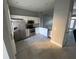 Kitchen featuring stainless steel appliances, white cabinets, and gray walls at 724 4Th S Ave # 8, St Petersburg, FL 33701