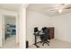 Bright bedroom with a ceiling fan, desk with monitors, and a comfortable chair at 10944 Keys Gate Dr, Riverview, FL 33579