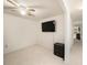 Bright bedroom with a ceiling fan, television, and closet at 10944 Keys Gate Dr, Riverview, FL 33579