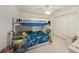 Cozy bedroom with a bunk bed, ceiling fan, and closet at 10944 Keys Gate Dr, Riverview, FL 33579