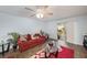 Cozy living room featuring stylish furnishings, wood-look floors, and sliding glass doors for natural light at 10944 Keys Gate Dr, Riverview, FL 33579