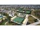 Aerial view of the community with tennis courts and bocce ball court at 10998 Gable Dig Loop, San Antonio, FL 33576