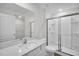 Bathroom featuring a large mirror, vanity with sink, and a glass-enclosed shower at 11073 Jackdaw Rd, Weeki Wachee, FL 34614