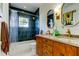 Beautiful bathroom features a double vanity and tile backsplash at 1208 E Giddens Ave, Tampa, FL 33603