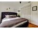 Cozy bedroom with a comfortable bed and built in storage at 1208 E Giddens Ave, Tampa, FL 33603