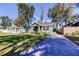 Quaint home features a large front yard and long driveway at 1208 E Giddens Ave, Tampa, FL 33603