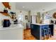 Bright, updated kitchen featuring island, stainless appliances, and hardwood floors at 1208 E Giddens Ave, Tampa, FL 33603