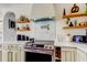 Close-up of modern kitchen area, featuring stone countertop and stainless steel oven at 1208 E Giddens Ave, Tampa, FL 33603