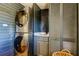 Laundry room with stacked washer/dryer and cabinets at 1208 E Giddens Ave, Tampa, FL 33603
