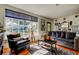 Comfortable living room featuring large window and stylish decor at 1208 E Giddens Ave, Tampa, FL 33603