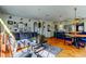 Bright living room with a large sofa, decor, and an open floorplan leading into the eat-in kitchen at 1208 E Giddens Ave, Tampa, FL 33603