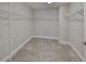 Walk-in closet with carpeted floors and wire shelving at 12779 Fisherville Way, Riverview, FL 33579