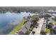 Picturesque lakeside community featuring brick townhomes, a swimming pool, ample parking, and stunning waterfront views at 13733 Juniper Blossom Dr, Tampa, FL 33618