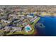 Lakefront townhome community with a pool, parking, and stunning water views surrounded by lush greenery at 13733 Juniper Blossom Dr, Tampa, FL 33618