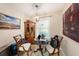 Charming dining room with a round table, decorative chandelier, and ample natural light at 13733 Juniper Blossom Dr, Tampa, FL 33618