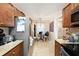 Kitchen featuring stainless steel appliances, tile floors, granite countertops, and eat-in breakfast nook at 13733 Juniper Blossom Dr, Tampa, FL 33618