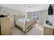 Relaxing main bedroom features neutral walls, plush carpet, and natural lighting at 14445 Haddon Mist Dr, Wimauma, FL 33598