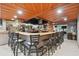Clubhouse bar area with seating, beverage selections, and modern lighting at 23227 Club Villas Dr # 38, Land O Lakes, FL 34639