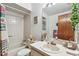 Bright bathroom featuring a sink, vanity, mirror, and tub with shower at 23227 Club Villas Dr # 38, Land O Lakes, FL 34639