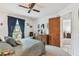 Cozy bedroom with a ceiling fan, soft carpet, and ample natural light at 23227 Club Villas Dr # 38, Land O Lakes, FL 34639