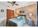 Inviting bedroom featuring a ceiling fan, comfortable bed, and closet at 23227 Club Villas Dr # 38, Land O Lakes, FL 34639